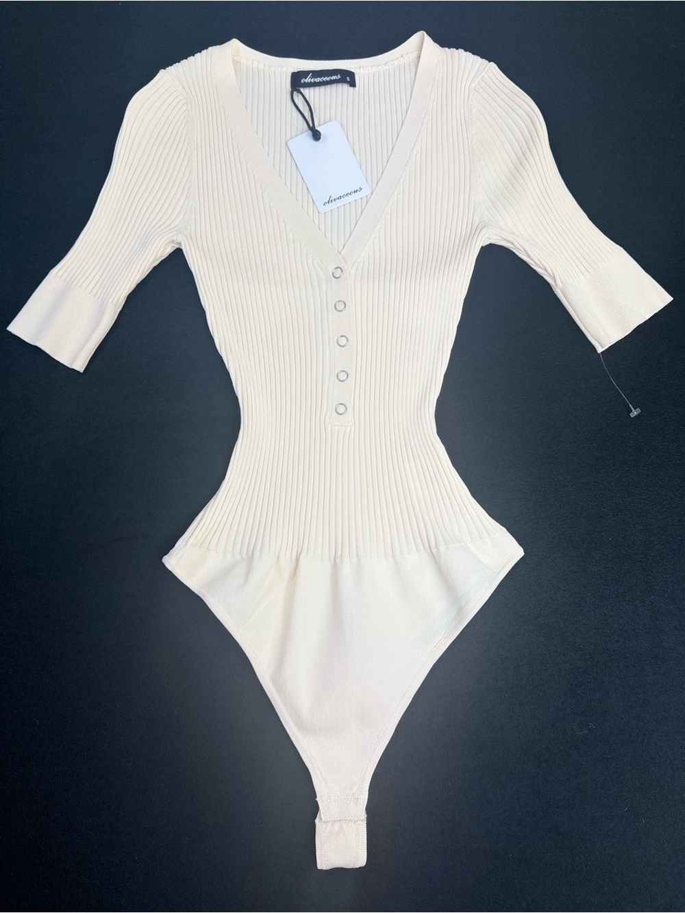 Olivaceous Cream Ribbed V-Neck Button Bodysuit